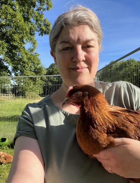 Claire holding one of her rescue chickens